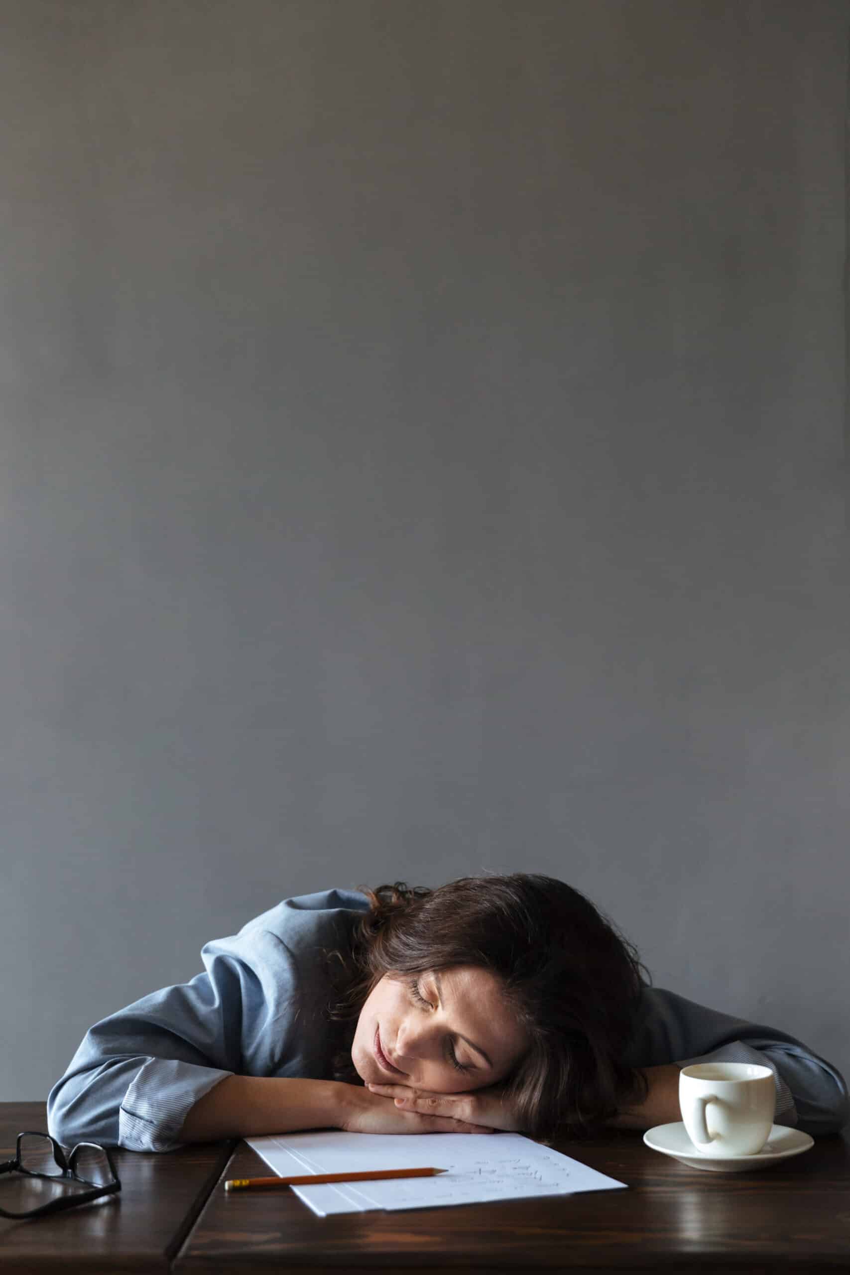 Sleeping woman writer lies indoors